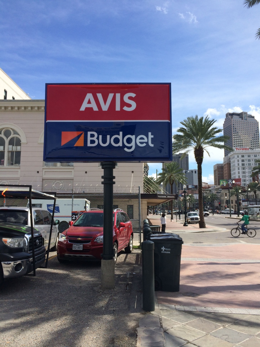 Pole sign installed in New Orleans on Canal Street for Avis Budget